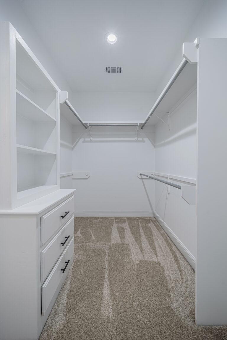 Primary walk-in closet, right off of laundry room
